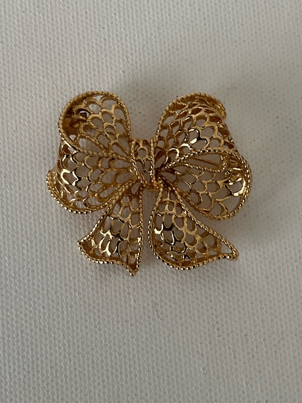 Napier Gold Tone Bow Filigree Brooch